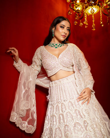 Soft Pink Net Lehenga Adorned With Mirrors, Pearls, and Intricate Threadwork