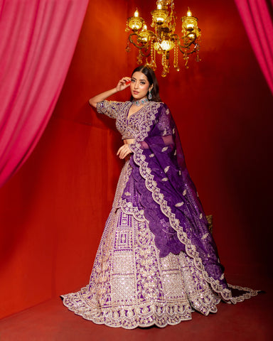 Royal Purple Raw Silk Lehenga Adorned with Exquisite Stones and Pearls